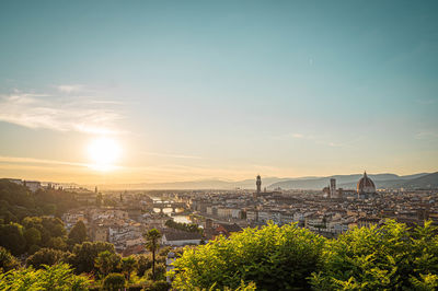 View of cityscape against sky during sunset