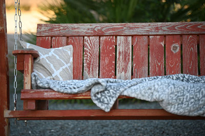 Close-up of rope on wooden bench