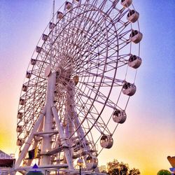 Low angle view of ferris wheel against sky