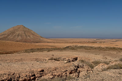 Scenic view of desert against sky