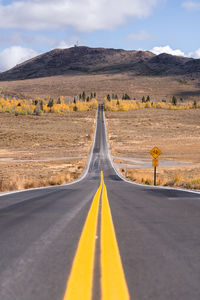 Empty road against sky