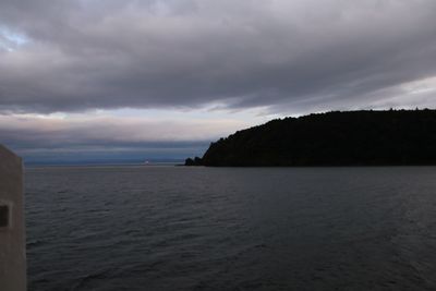 Scenic view of sea against sky at dusk