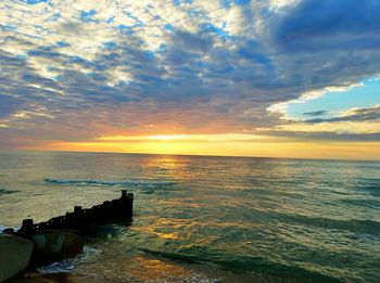 Scenic view of sea against dramatic sky