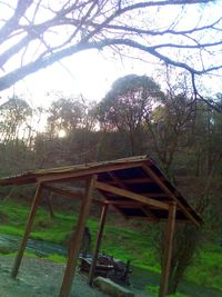 Abandoned built structure on landscape against sky