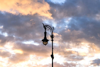 Low angle view of street light against sky