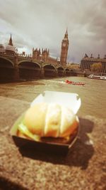 Ice cream cone in city against sky