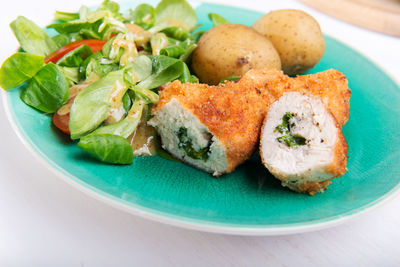 Close-up of fish served in plate on table