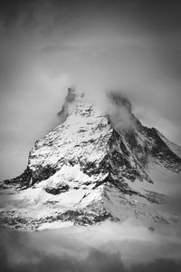 Scenic view of snowcapped mountain against sky