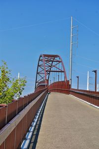 Low angle view of bridge against clear blue sky