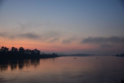 Scenic view of sea against sky at sunset