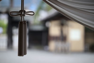 Close-up of tassel hanging outdoors