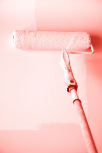 Close-up of pink can against white background