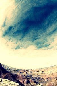 Scenic view of landscape against cloudy sky