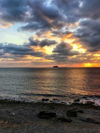 Scenic view of sea against sky during sunset