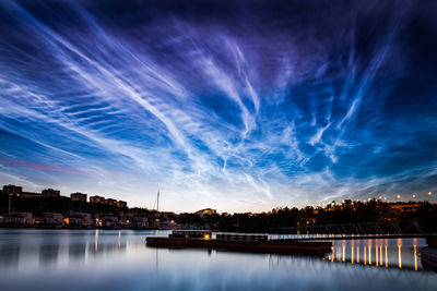 View of calm lake against clouds