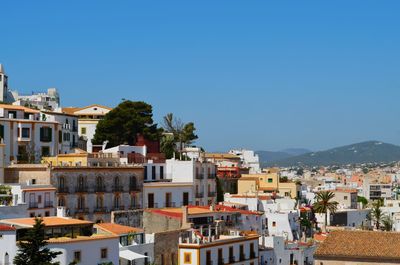 Buildings in old town ibiza  against clear sky