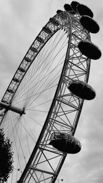 Low angle view of ferris wheel against sky