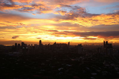 Cityscape against sky during sunset