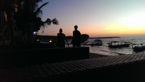 Silhouette of woman at sunset