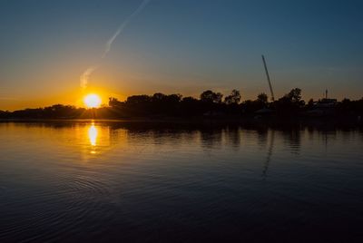Scenic view of lake against sky during sunset