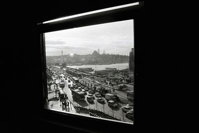 High angle view of buildings seen through window