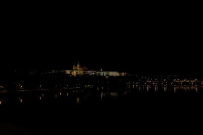 Reflection of illuminated buildings in water at night