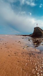 Scenic view of beach against sky