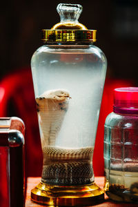 Close-up of glass jar on table