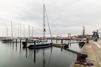 Scenic view of sailing boats moored in the harbour. sassnitz is a small town located in rugen island