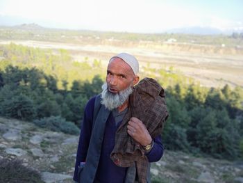 Full length of man standing on land