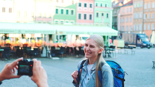 Portrait of young woman using mobile phone