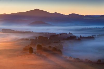 Scenic view of mountains against sky during sunset