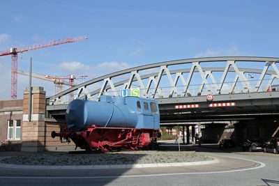 Train at railroad station against sky