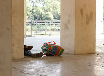 Rear view of woman sitting by door