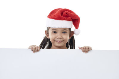 Portrait of a smiling girl over white background