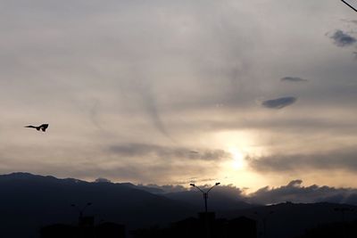 Silhouette of mountain range at sunset