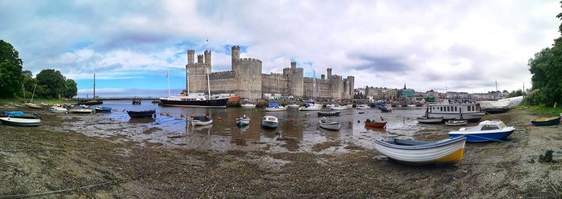 Caernarfon castle viewed across a river. caernarfon. gwynedd. wales.uk