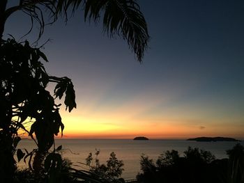 Scenic view of sea against sky at sunset