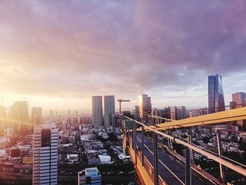 High angle view of buildings against sky during sunset