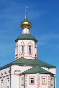 Low angle view of church against blue sky