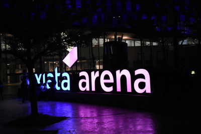 Information sign in city at night