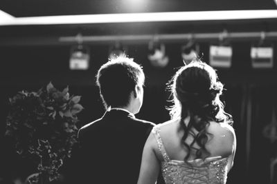 Rear view of bride and groom standing 