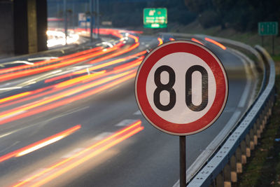 Illuminated light trails on road at night