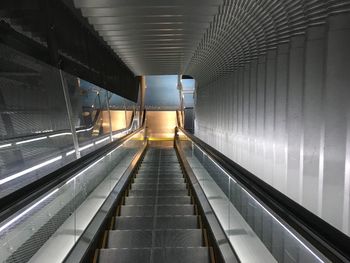 Interior of illuminated escalator