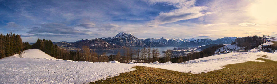 Panoramic view of snowcapped mountains against sky during winter