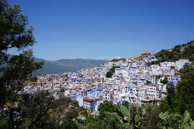 Panoramic view of cityscape against clear sky