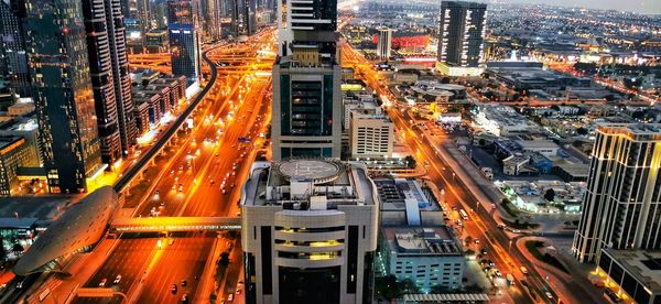 High angle view of illuminated city street at night