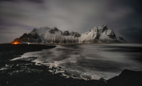 Scenic view of snowcapped mountains against sky during winter