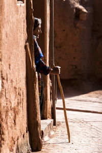 Side view of person on rock