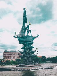 Statue of liberty against cloudy sky